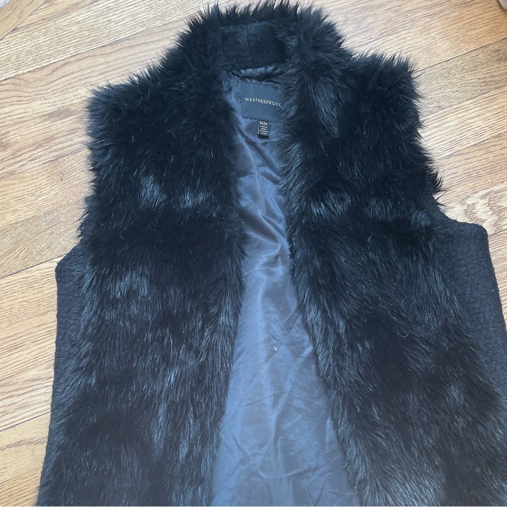Women’s black faux fur vest